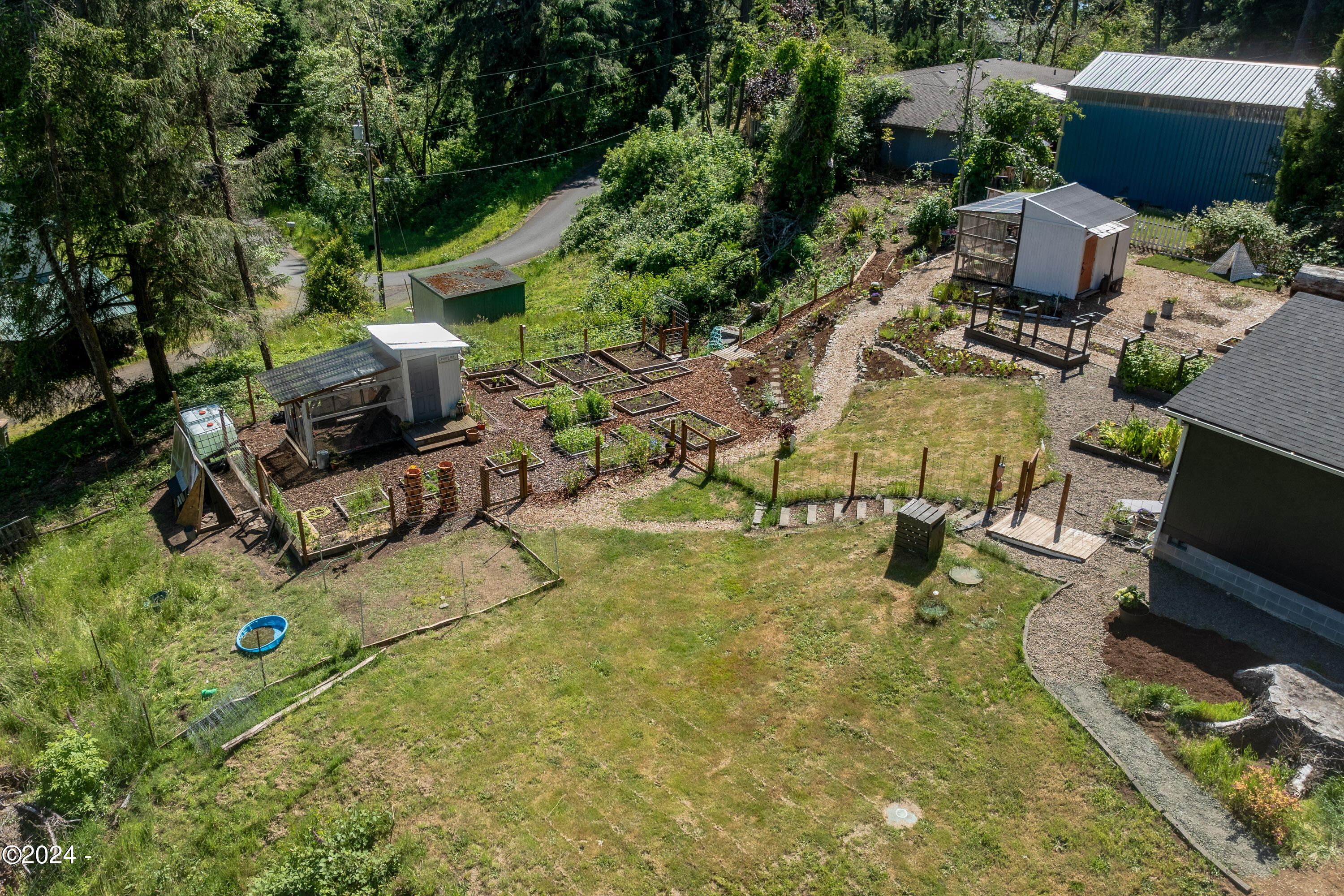 405 Southeast John Nye Road Newport, OR 97365 - Photo 34 of 54 Overlooking chicken coop & gardens