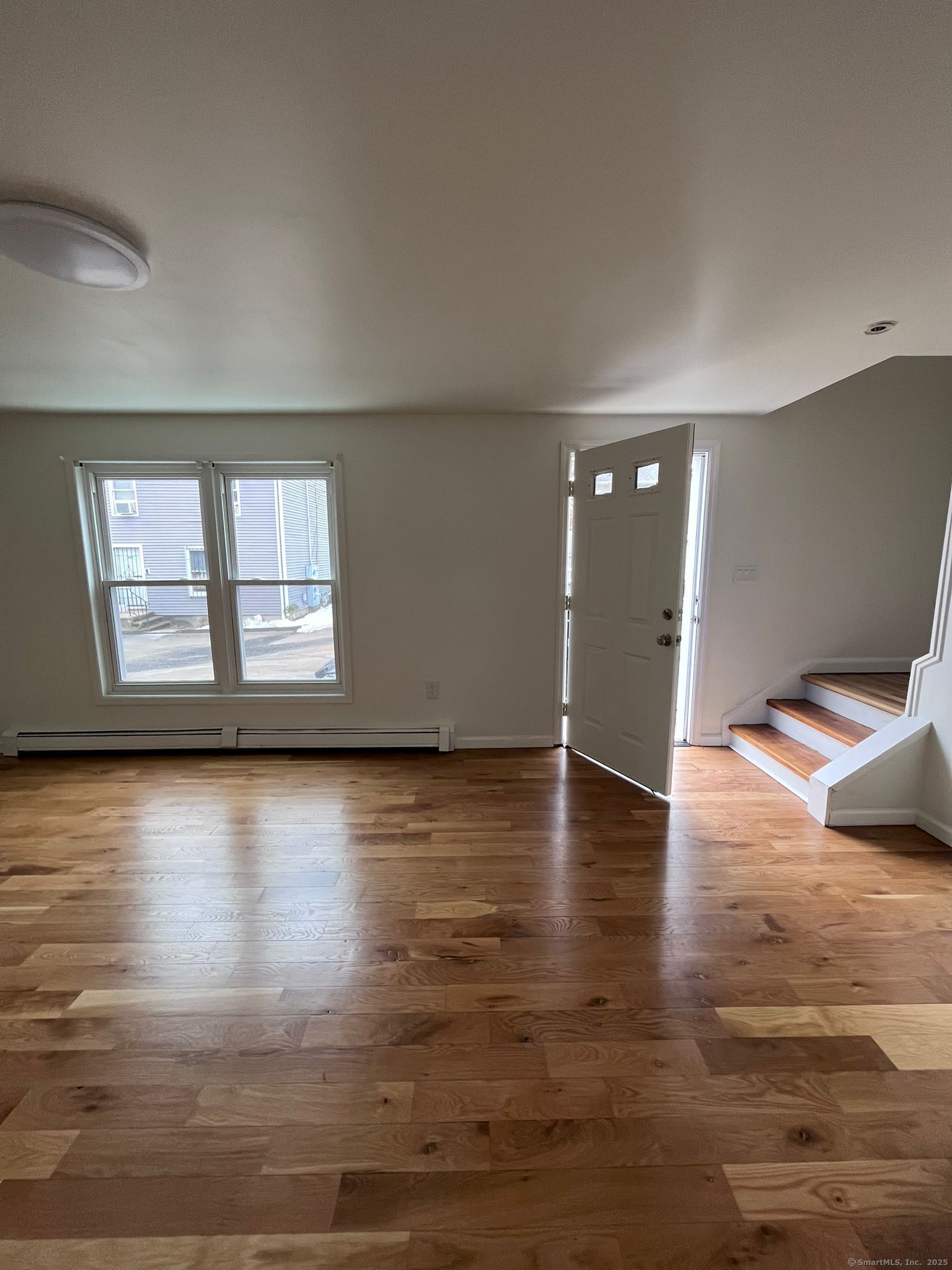 46 Orchard Street, Unit 52C New Haven, CT 06519 - Photo 11 of 12 a view of a livingroom with wooden floor