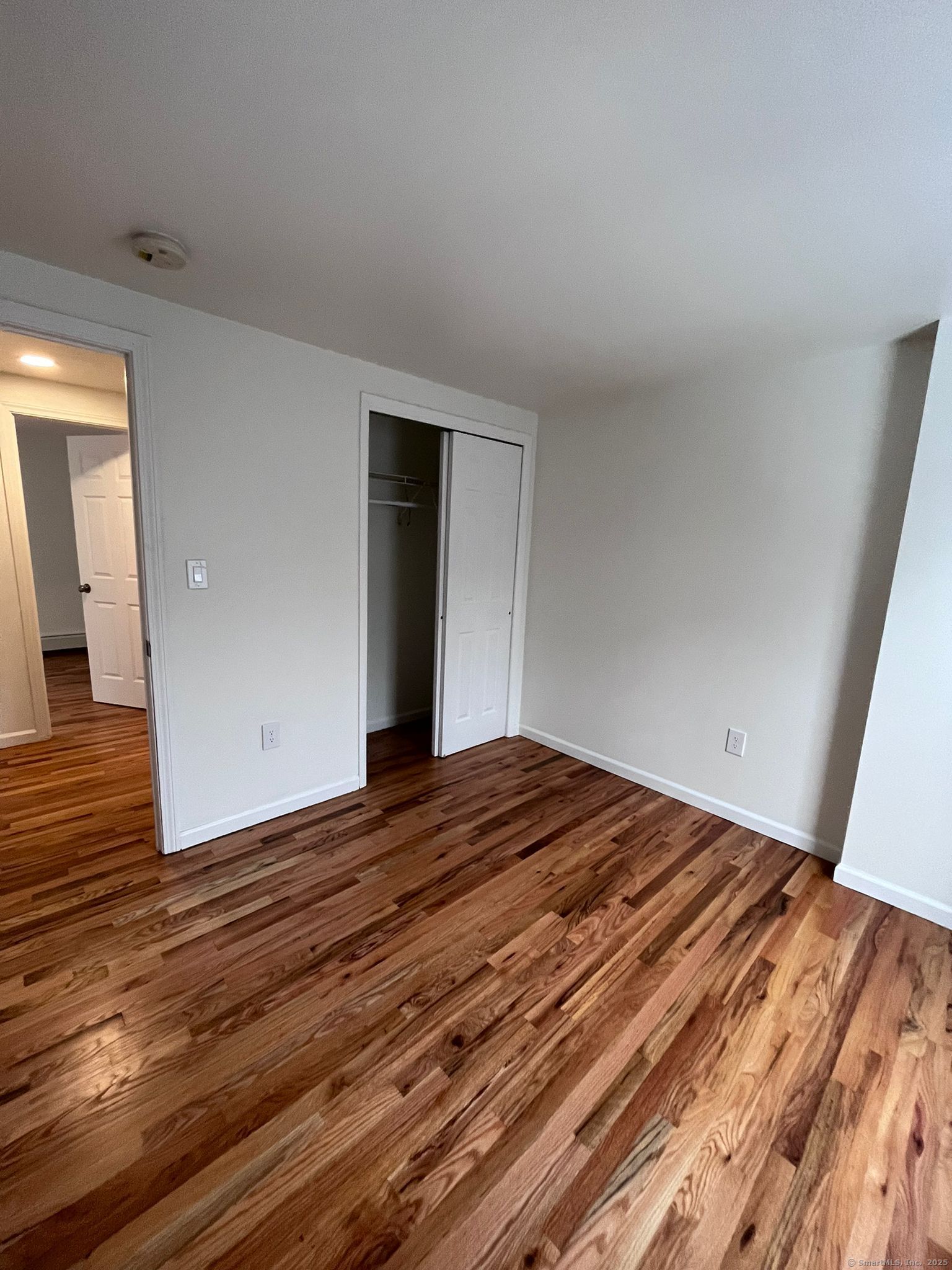 46 Orchard Street, Unit 52C New Haven, CT 06519 - Photo 9 of 12 a view of empty room with wooden floor