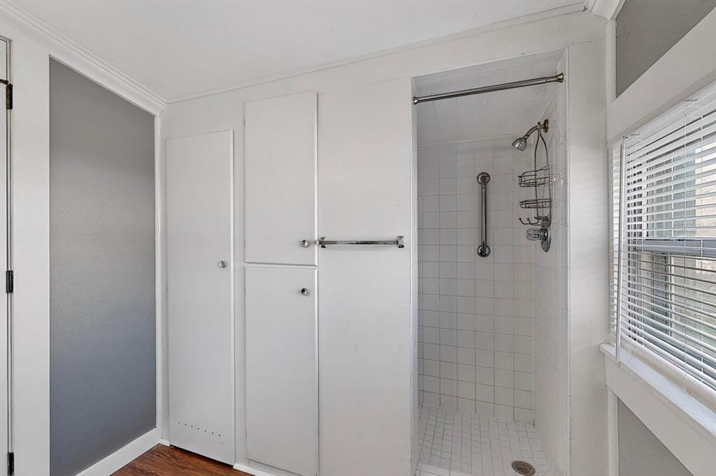 507 North Rusk Street Weatherford, TX 76086 - Photo 17 of 35 a bathroom with a shower