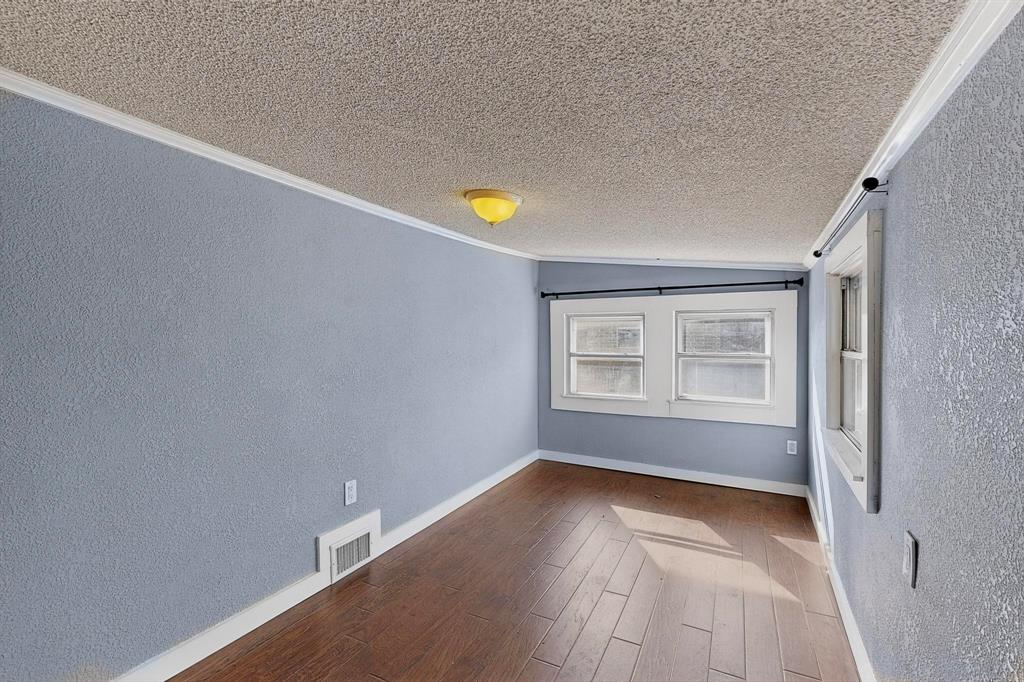 507 North Rusk Street Weatherford, TX 76086 - Photo 19 of 35 a view of an empty room with a window