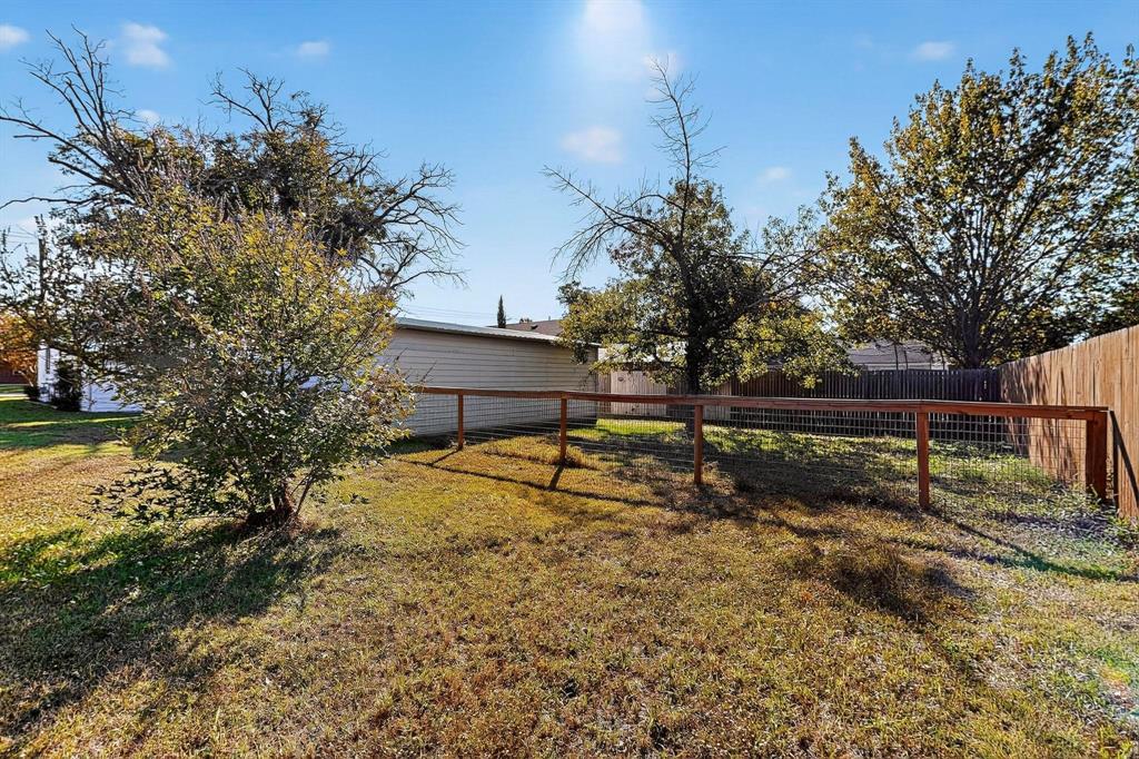 507 North Rusk Street Weatherford, TX 76086 - Photo 28 of 35 a view of backyard with wooden fence