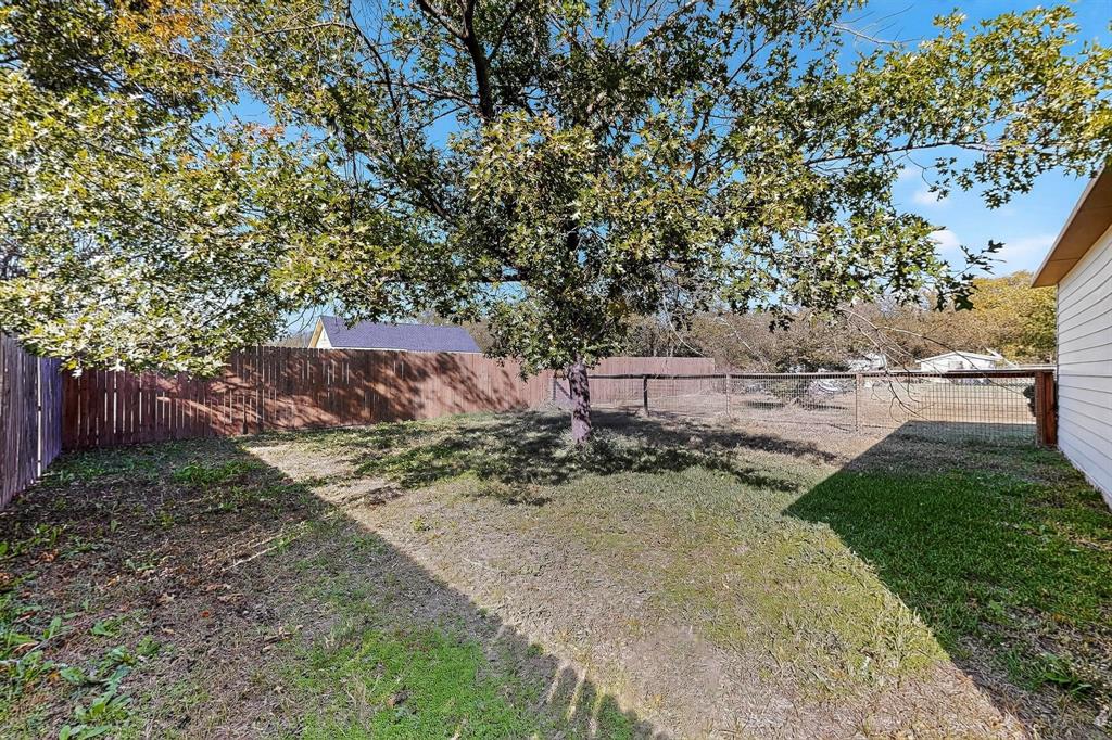 507 North Rusk Street Weatherford, TX 76086 - Photo 29 of 35 a view of a backyard with large trees