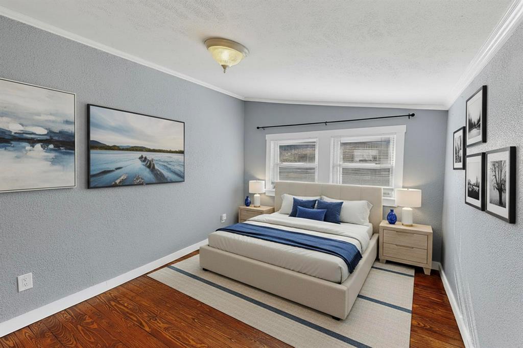 507 North Rusk Street Weatherford, TX 76086 - Photo 6 of 35 a bedroom with a bed and painting on the wall