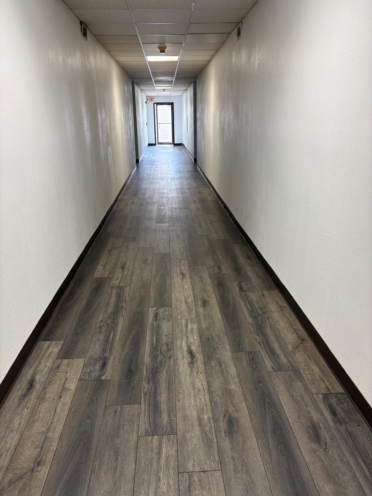 3055 Walnut Bend Lane, Unit 33 Houston, TX 77042 - Photo 15 of 18 a view of gallery with wooden floor