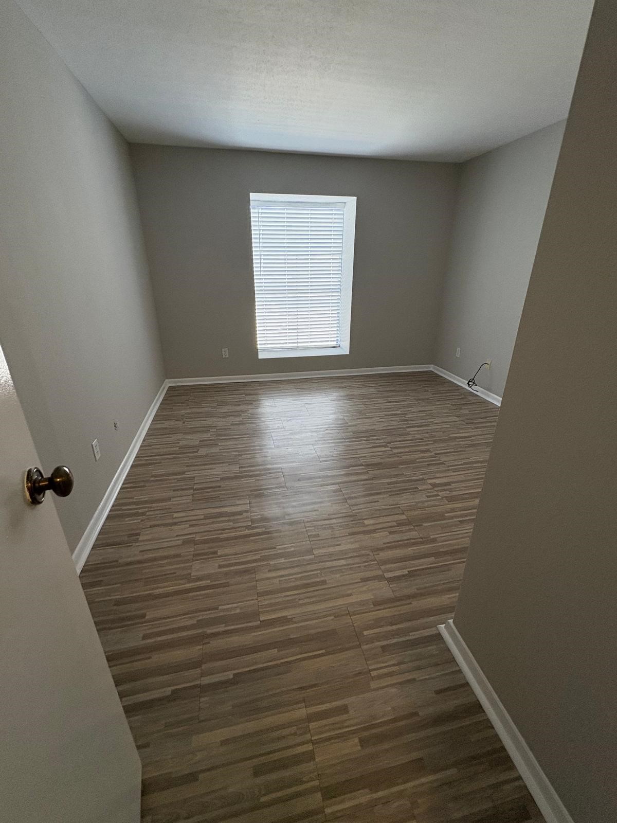 3055 Walnut Bend Lane, Unit 33 Houston, TX 77042 - Photo 3 of 18 wooden floor in an empty room