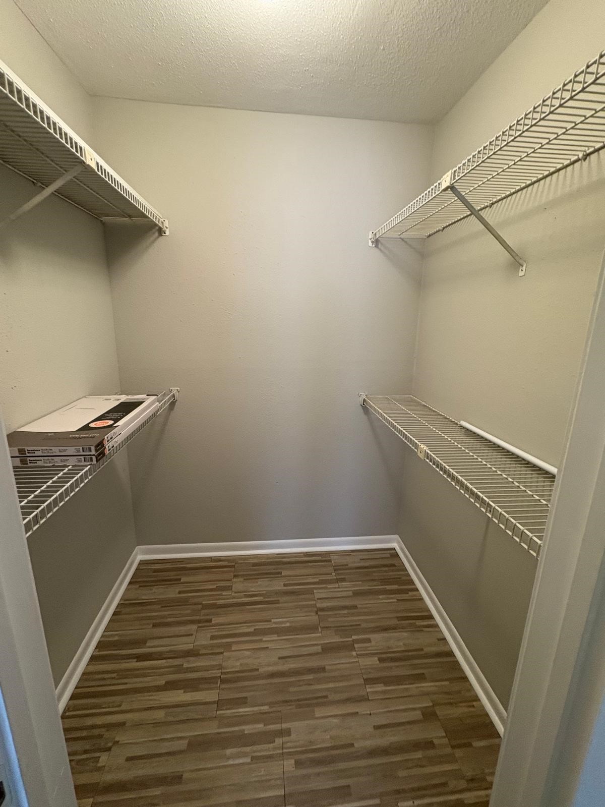 3055 Walnut Bend Lane, Unit 33 Houston, TX 77042 - Photo 5 of 18 a view of a room with wooden floor and white walls
