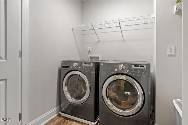 a view of storage and utility room with washer and dryer