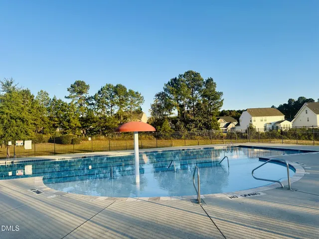 a view of a terrace with a table and chairs