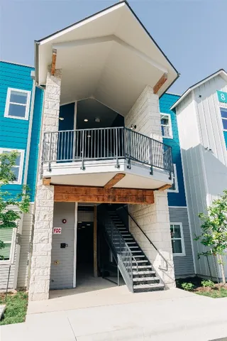 a view of a balcony with furniture