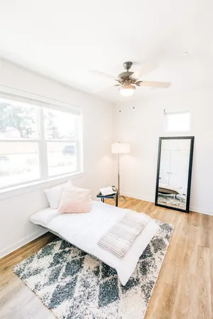 a bedroom with a bed and a dresser