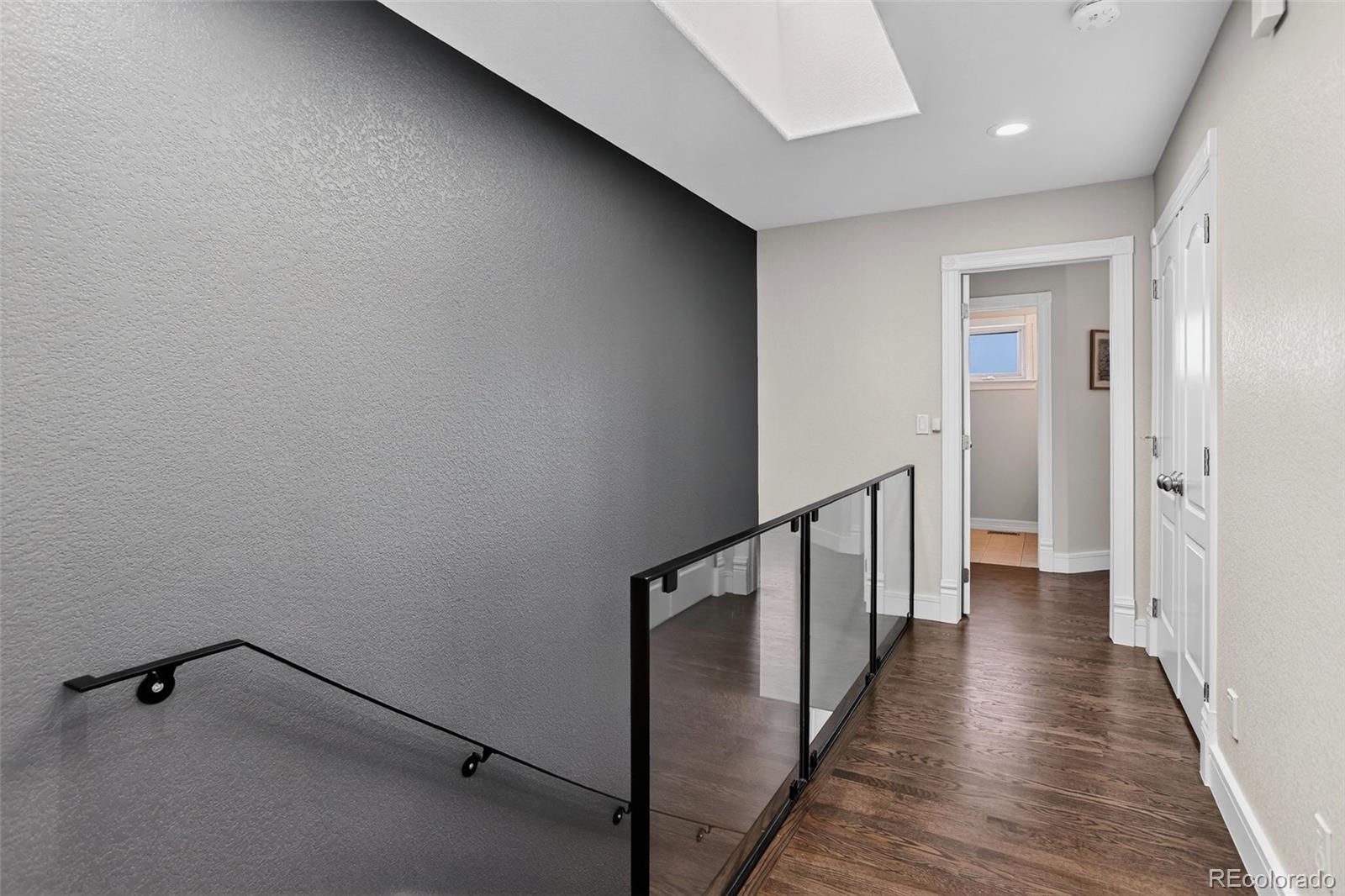 2311 Decatur Street Denver, CO 80211 - Photo 13 of 31 a view of a hallway with wooden floor