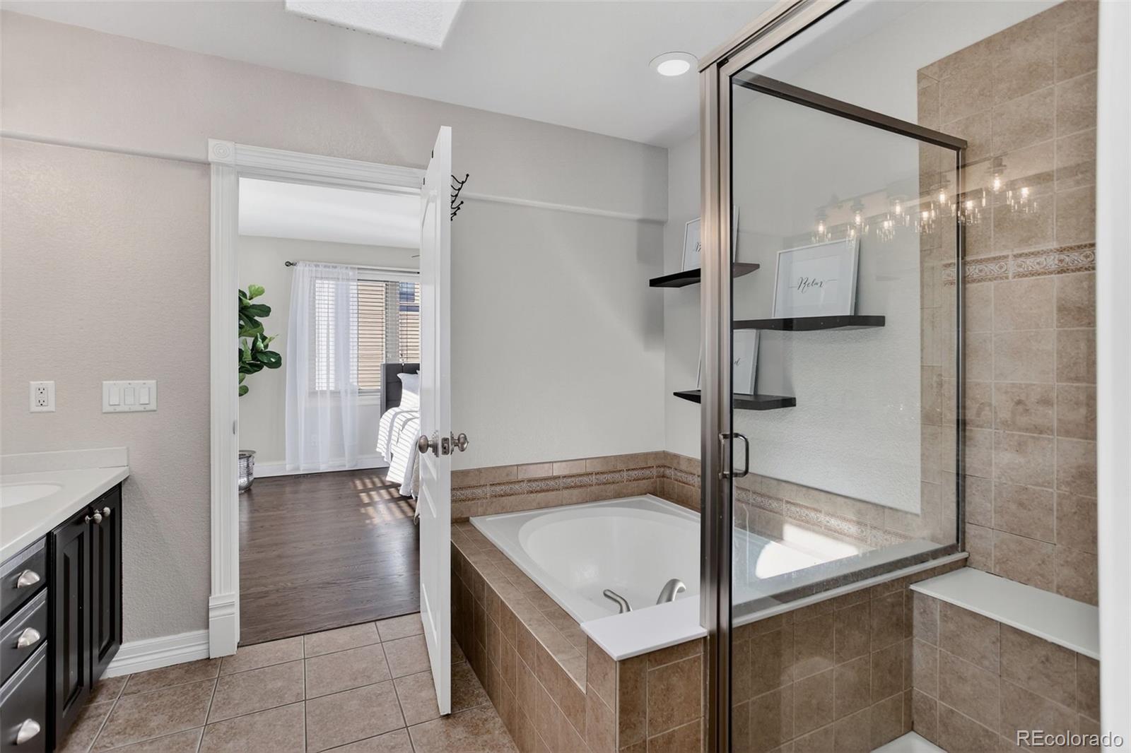 2311 Decatur Street Denver, CO 80211 - Photo 16 of 31 a bathroom with a shower and a sink