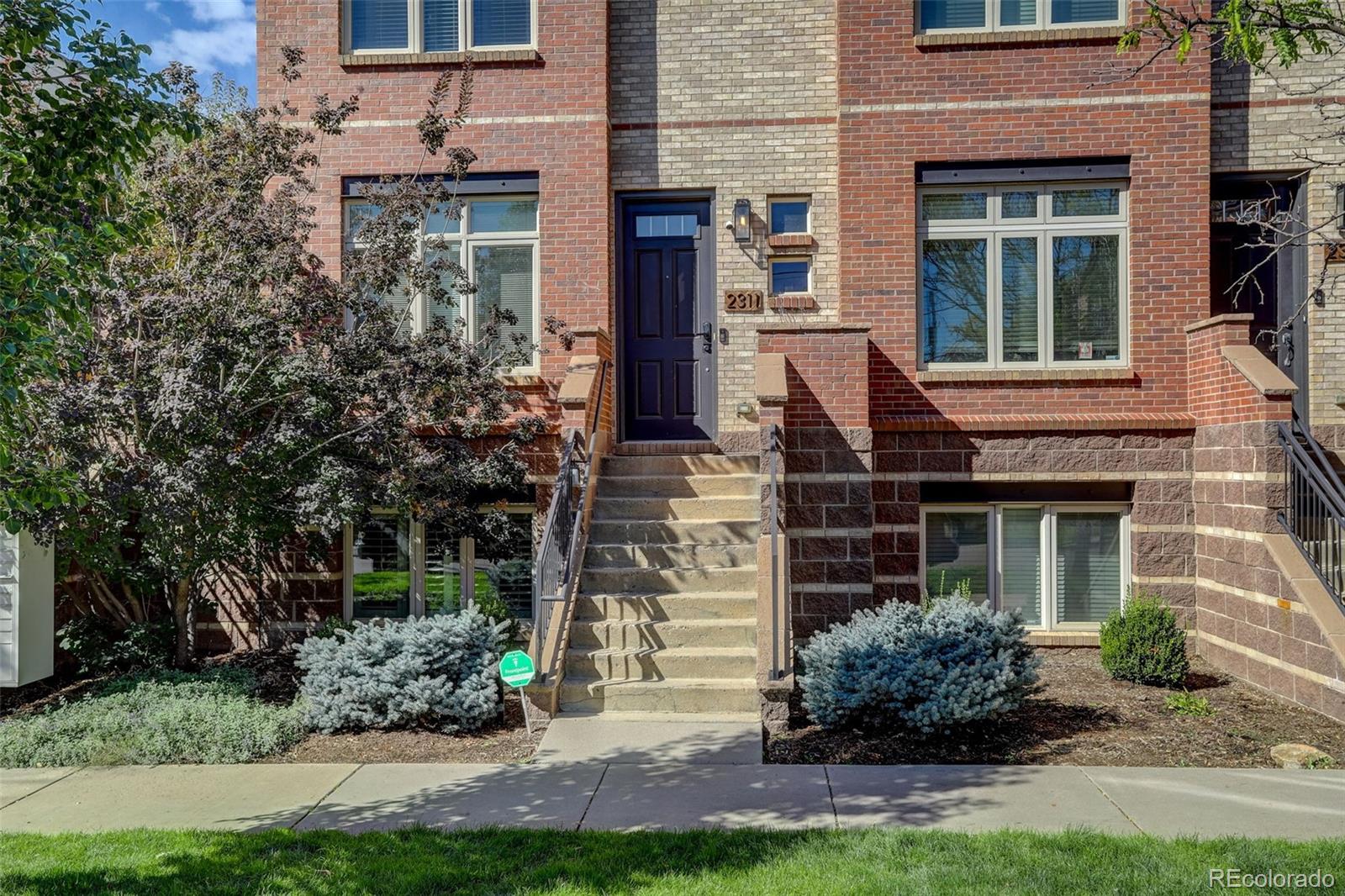 2311 Decatur Street Denver, CO 80211 - Photo 2 of 31 front view of a brick house with a yard