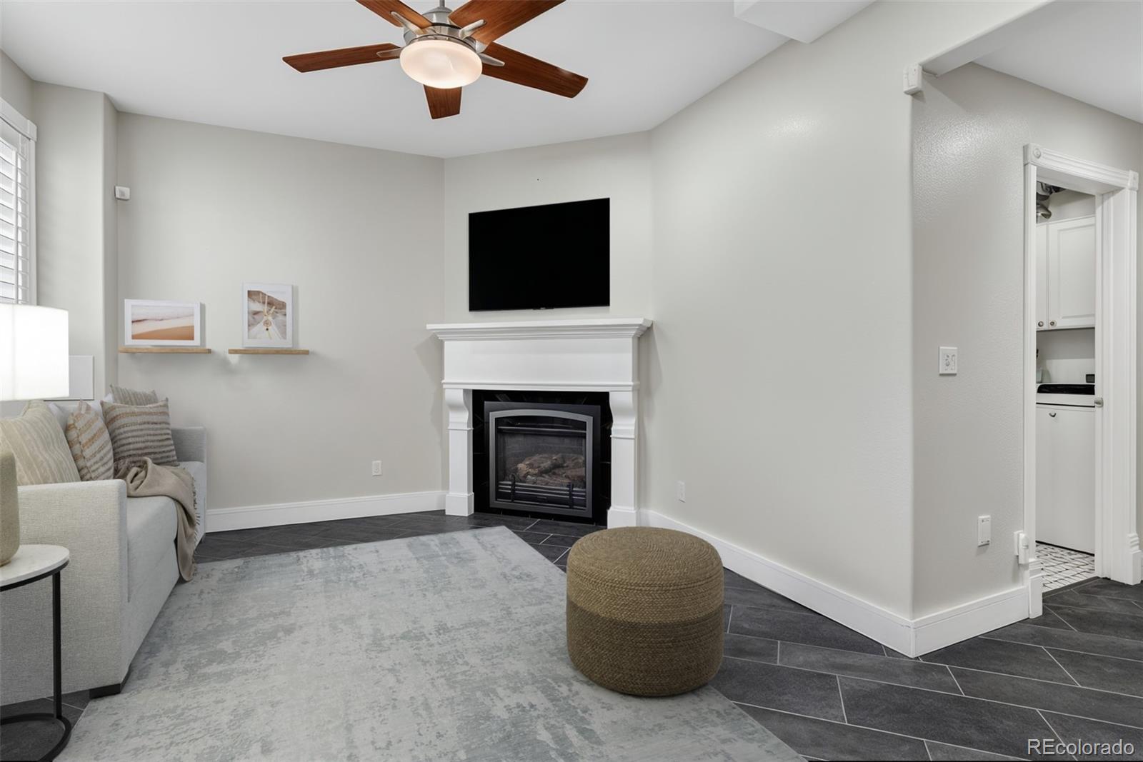 2311 Decatur Street Denver, CO 80211 - Photo 21 of 31 a living room with furniture and a fireplace