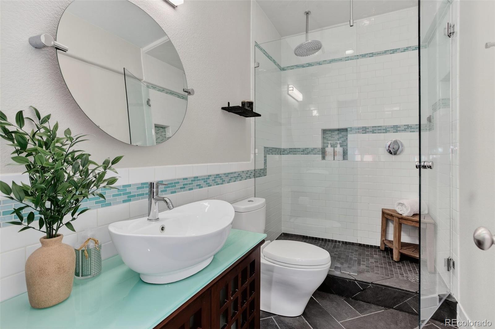 2311 Decatur Street Denver, CO 80211 - Photo 26 of 31 a bathroom with a sink toilet and shower