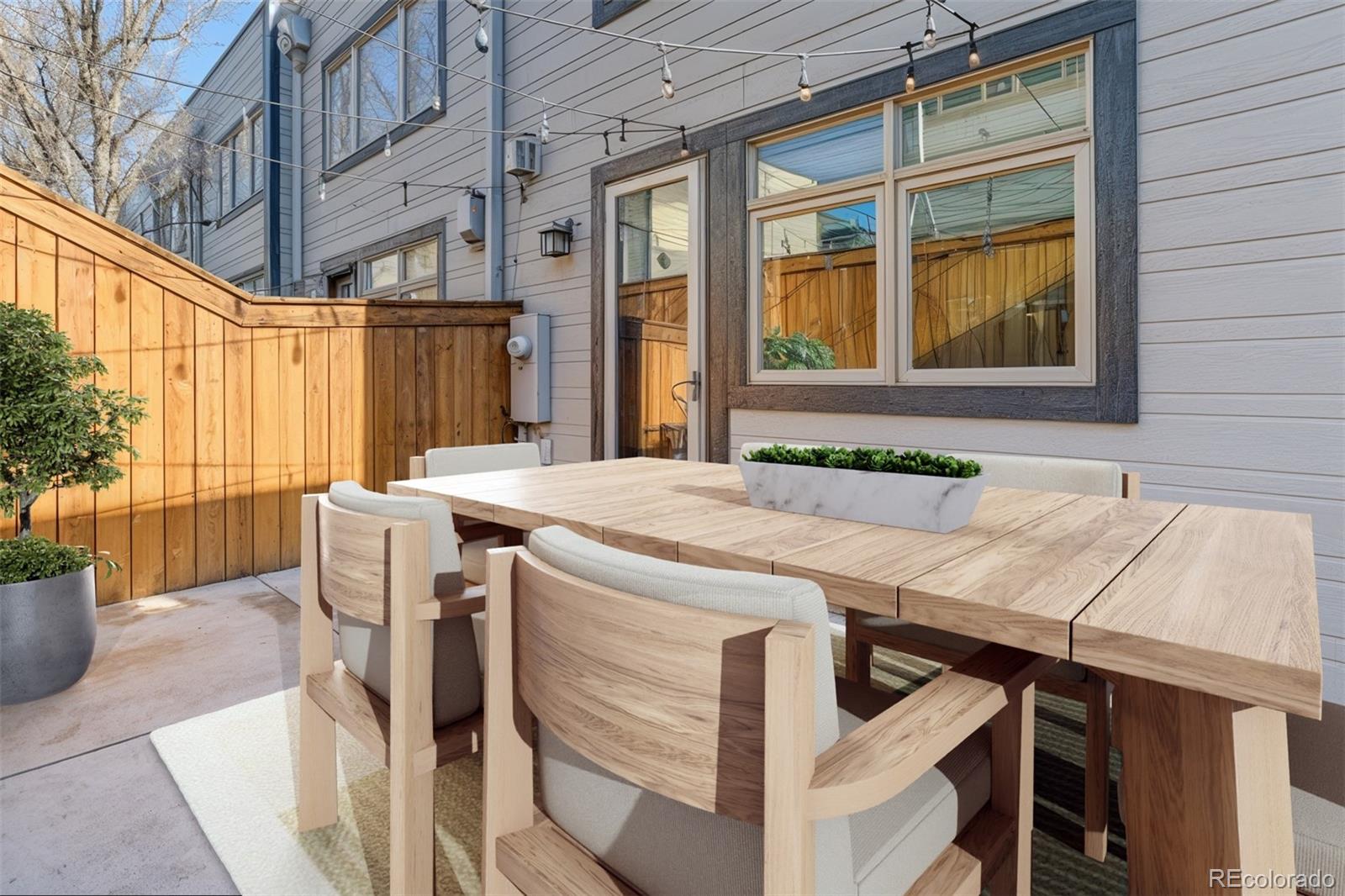 2311 Decatur Street Denver, CO 80211 - Photo 28 of 31 a view of a patio with table and chairs