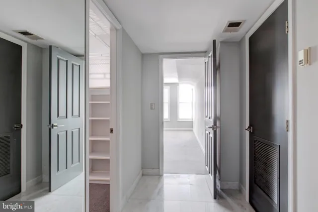 a view of a bathroom with a glass door