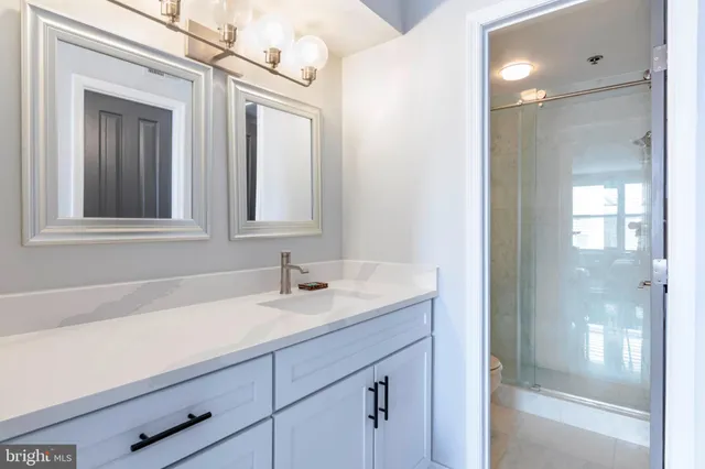 a bathroom with a sink a vanity and a mirror