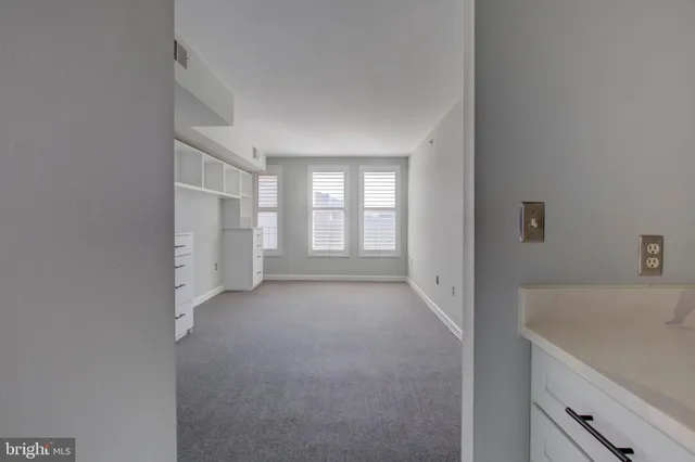 a view of a room that has a sink and window