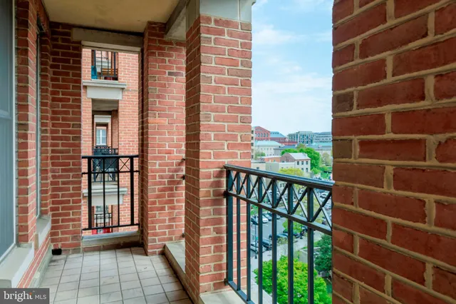a view of a balcony with a floor to ceiling window