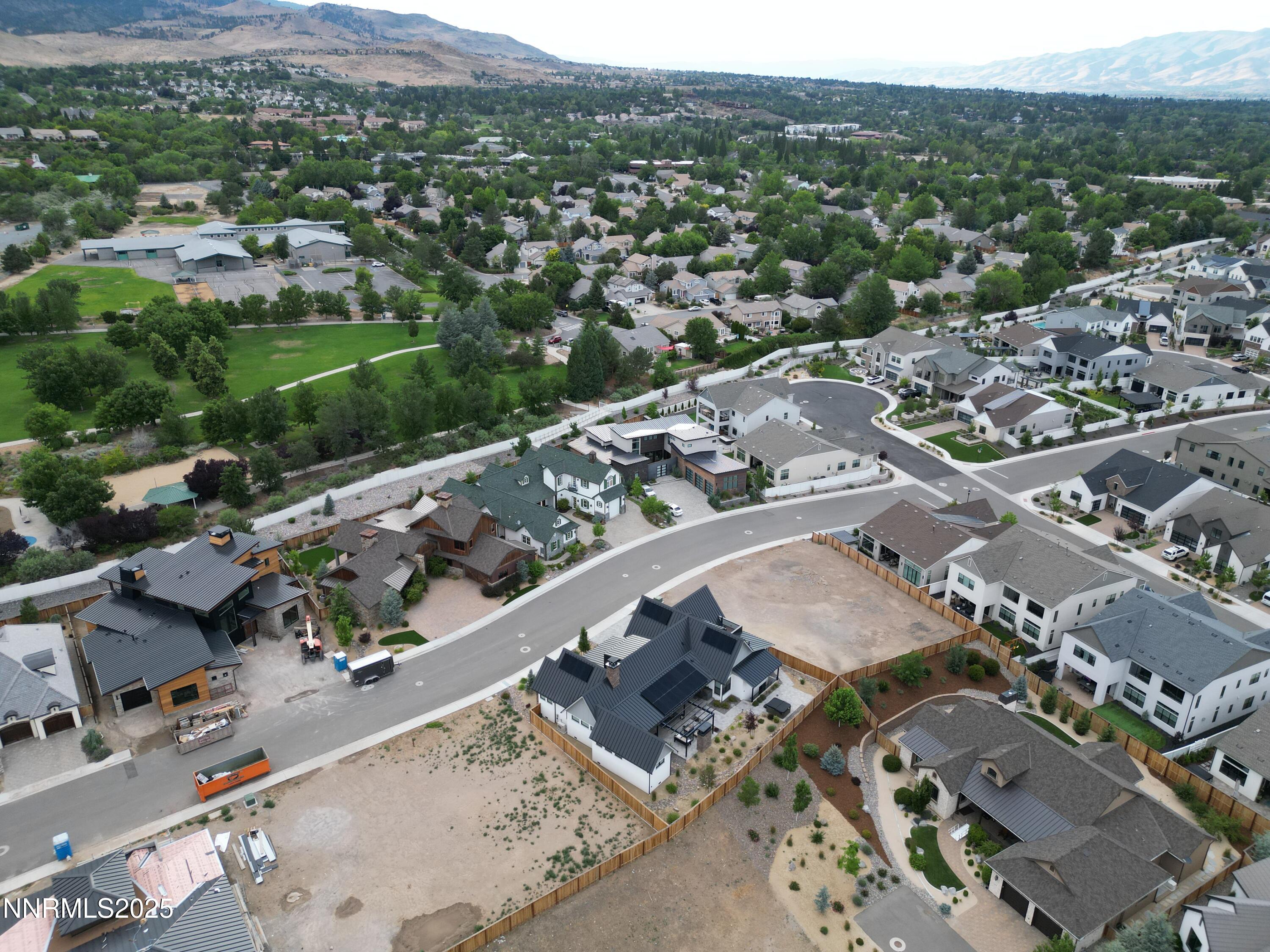 6143 Falabella Way, Unit 21 Reno, NV 89511 - Photo 4 of 12 an aerial view of a city with lots of residential buildings