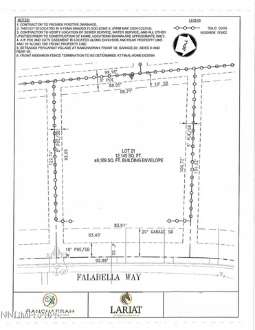 a white building with a white fence