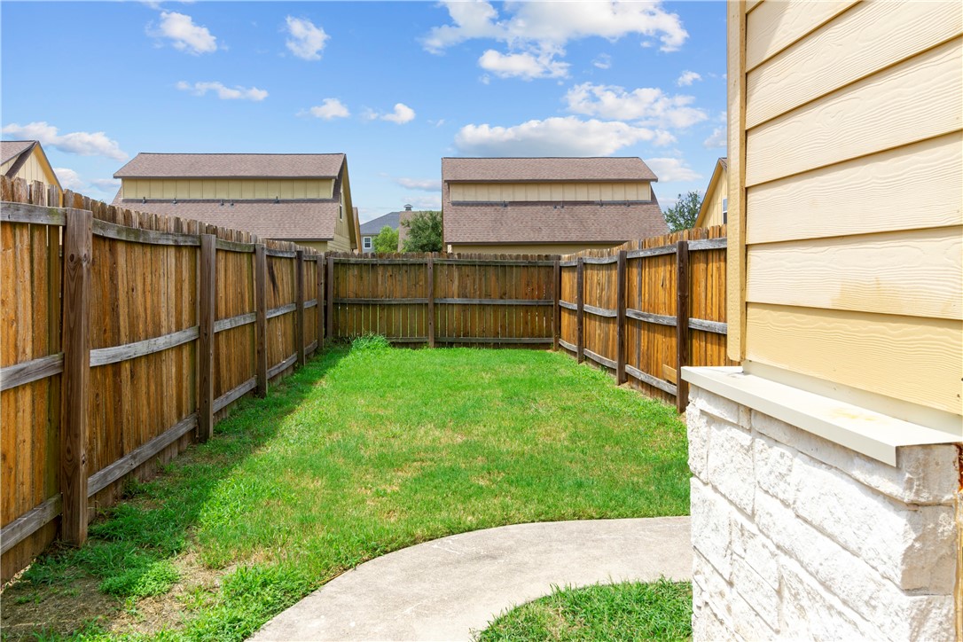 3407 Cullen Trail College Station, TX 77845 - Photo 3 of 22 a view of a backyard with wooden fence