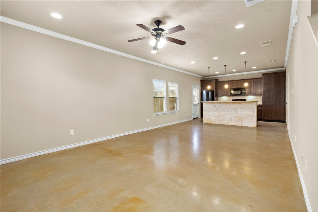3407 Cullen Trail College Station, TX 77845 - Photo 5 of 22 a view of a kitchen with a sink and a ceiling fan