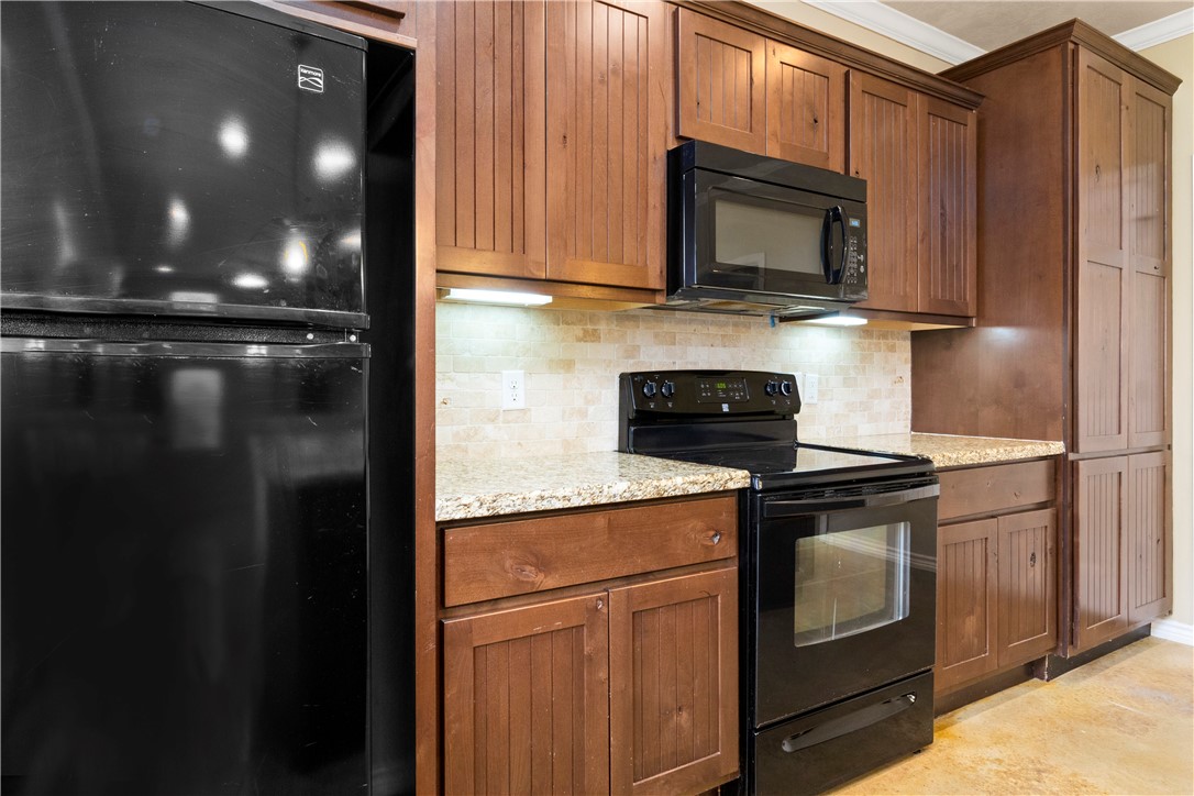3407 Cullen Trail College Station, TX 77845 - Photo 7 of 22 a kitchen with a refrigerator stove and microwave