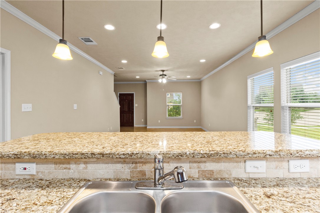 3407 Cullen Trail College Station, TX 77845 - Photo 9 of 22 a bathroom with a granite countertop sink and a large mirror