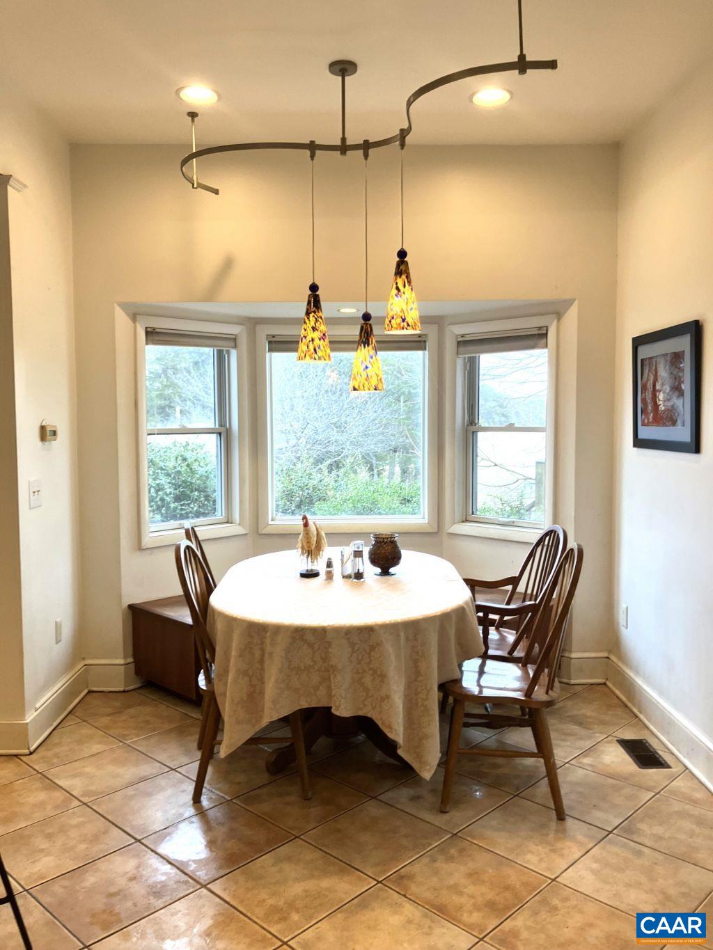 877 Holland Creek Road Louisa, VA 23093 - Photo 12 of 48 a dining room with furniture and window