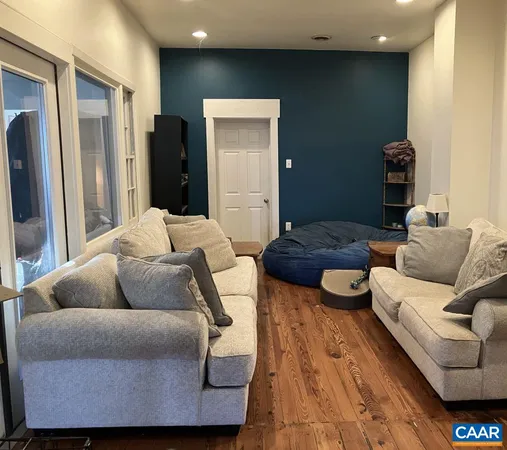 a bedroom with a bed and a fireplace