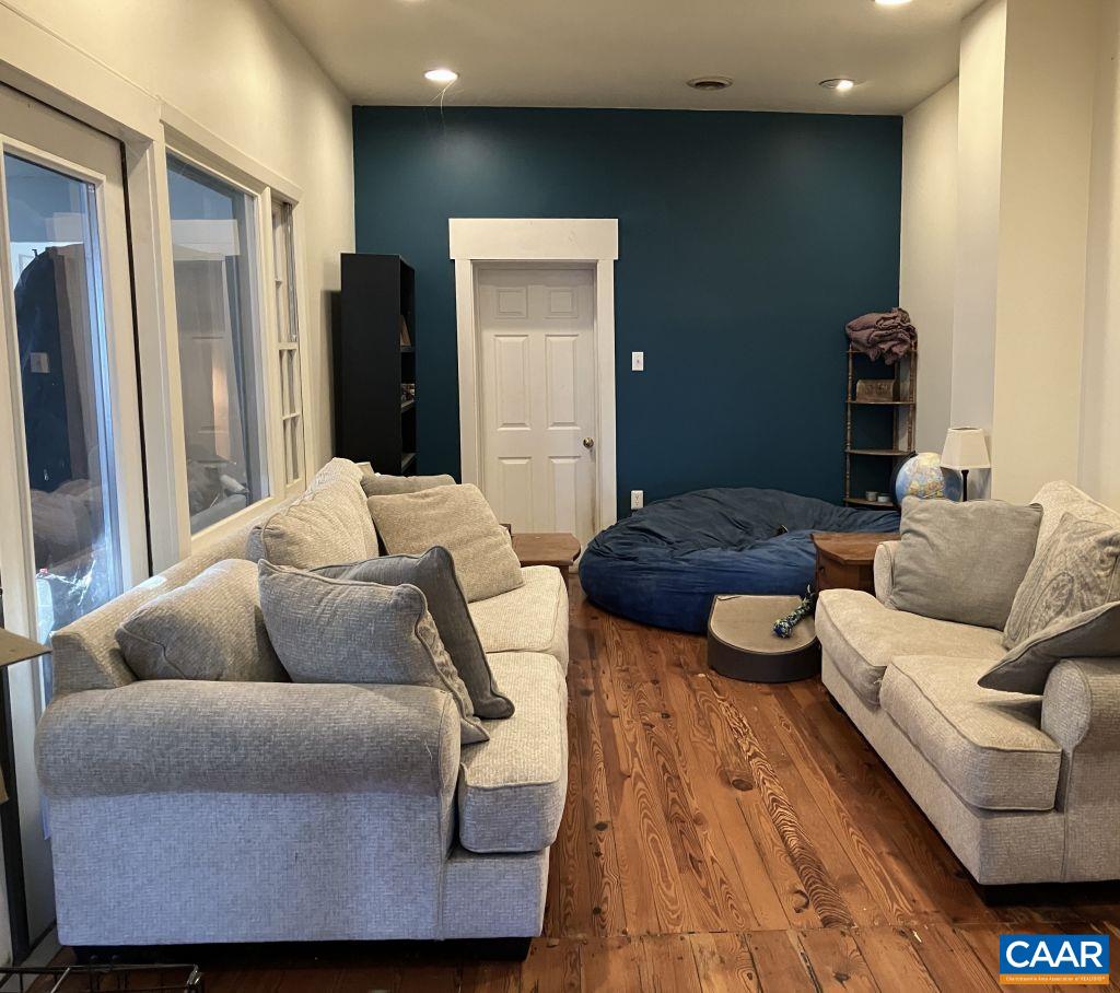 877 Holland Creek Road Louisa, VA 23093 - Photo 15 of 48 a living room with furniture and a refrigerator
