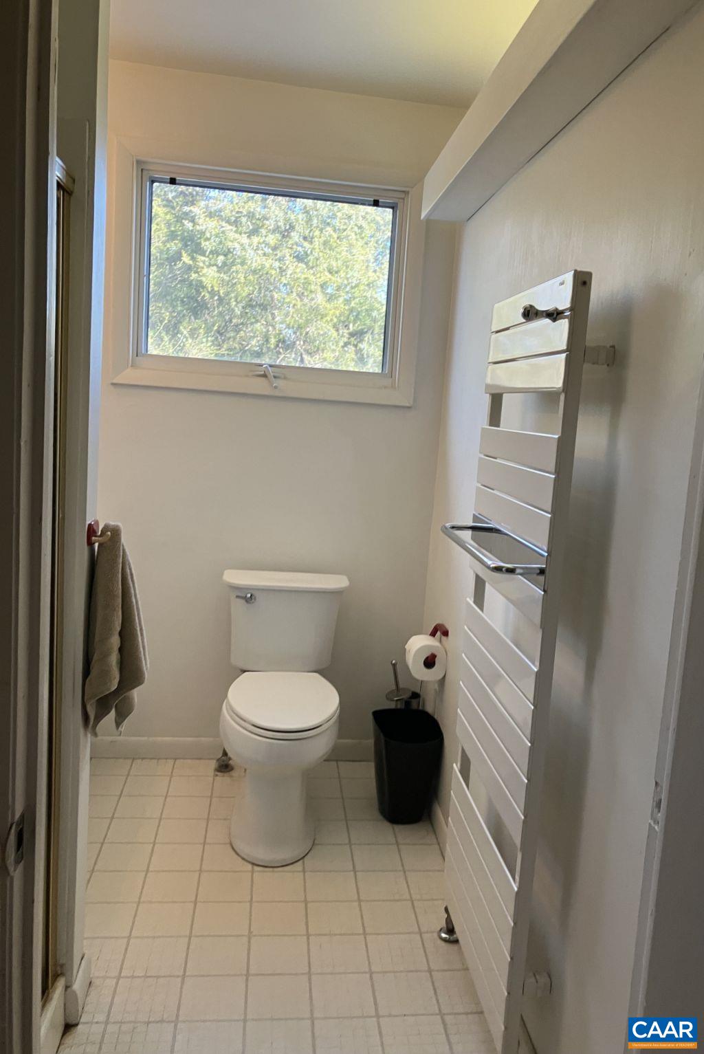 877 Holland Creek Road Louisa, VA 23093 - Photo 27 of 48 a white toilet sitting next to a bathroom sink
