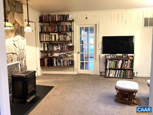 a room with furniture and a potted plant