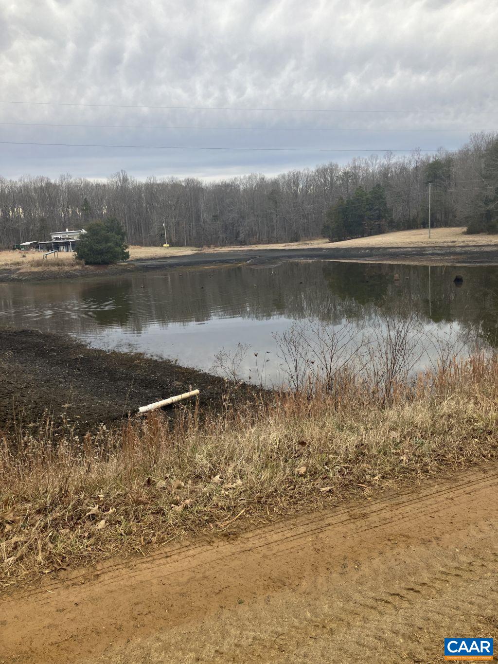 877 Holland Creek Road Louisa, VA 23093 - Photo 39 of 48 a view of a lake with houses in the back