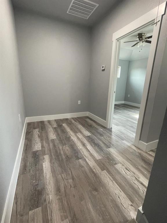 401 West Elm Street Denison, TX 75020 - Photo 11 of 13 wooden floor in a room