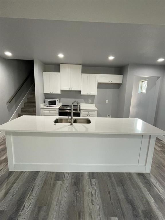 401 West Elm Street Denison, TX 75020 - Photo 4 of 13 a living room with stainless steel appliances furniture a refrigerator and a stove top oven