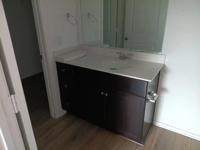 a bathroom with a toilet and a sink
