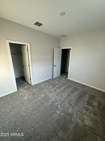 a view of an empty room and closet