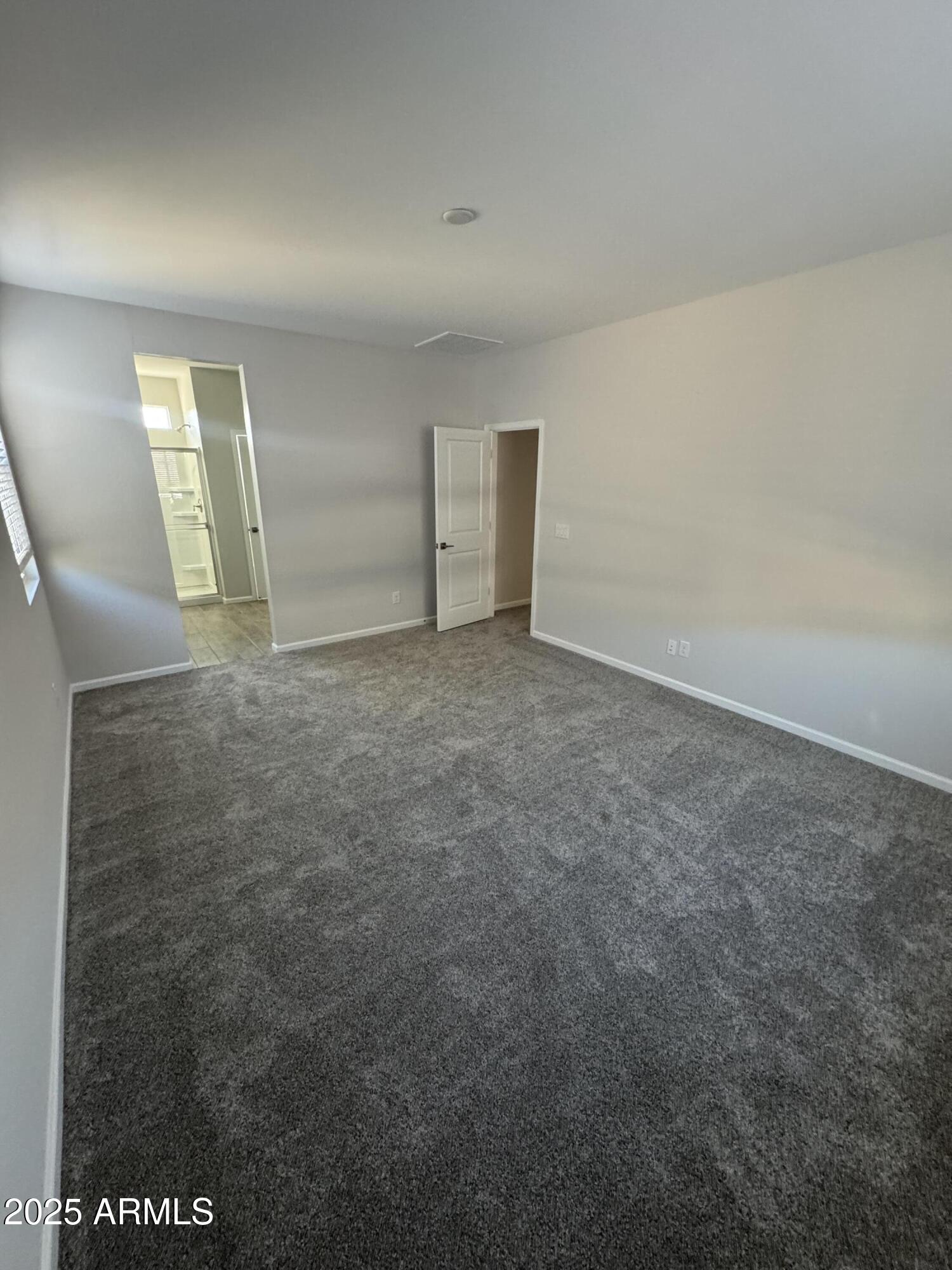 2665 East Boulder Avenue Apache Junction, AZ 85119 - Photo 9 of 22 an empty room with windows