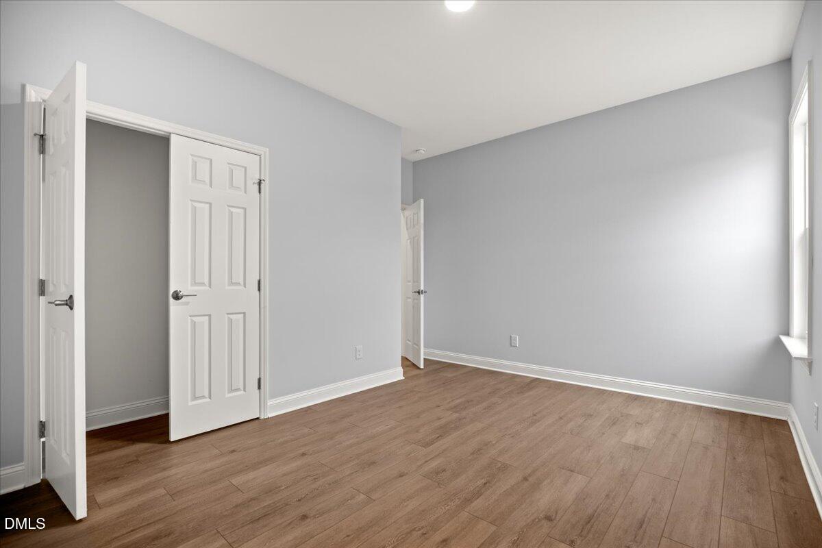 1300 Nick Coley Road Whitakers, NC 27891 - Photo 28 of 47 a view of an empty room with wooden floor