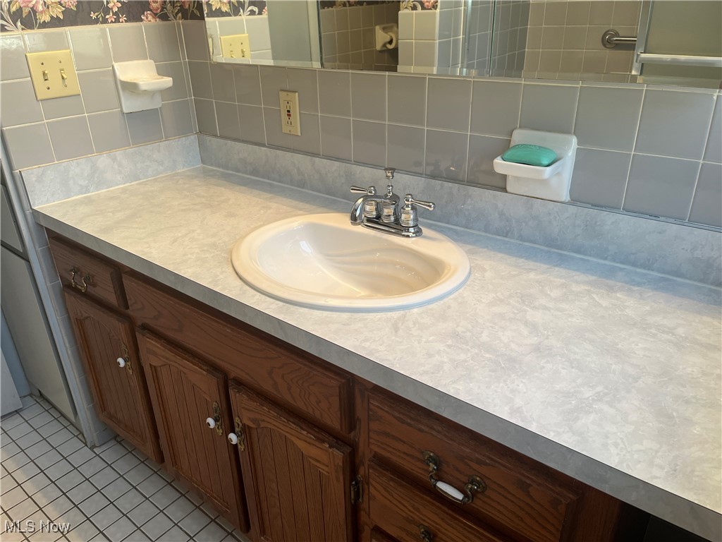 9152 Fosdick Road Cleveland, OH 44125 - Photo 26 of 45 Full Bathroom upstairs featuring vanity and ceramic tile flooring