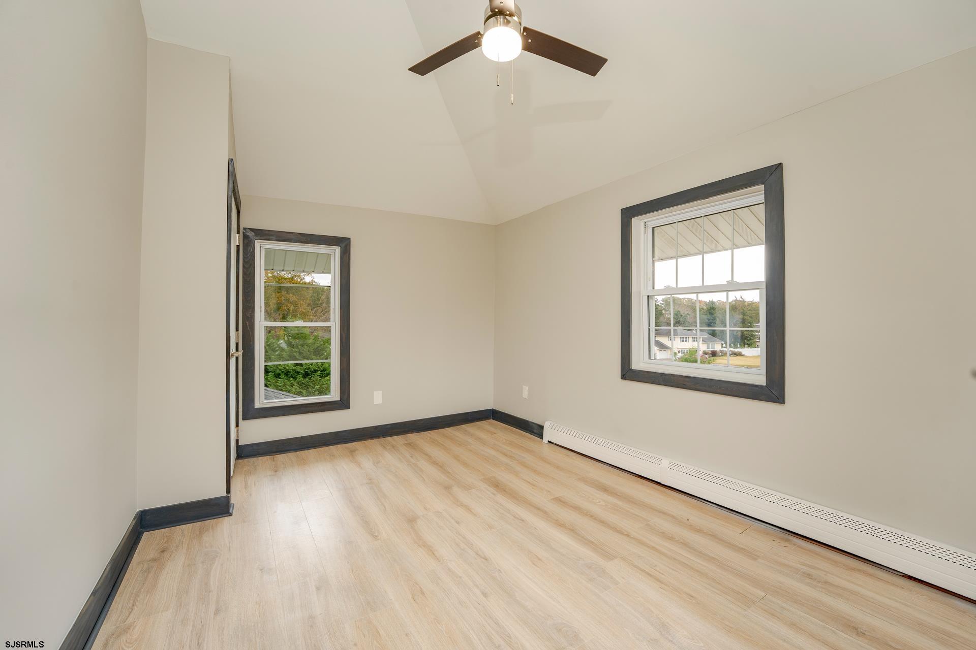 1203 West Mill Road Northfield, NJ 08225 - Photo 28 of 90 an empty room with windows and fan