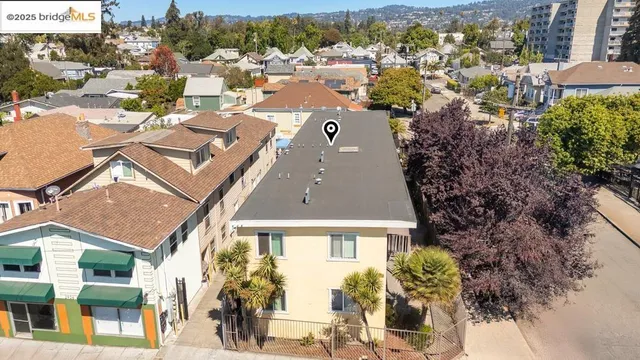 an aerial view of a house with a yard