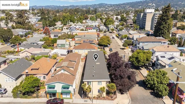 an aerial view of residential building with green space