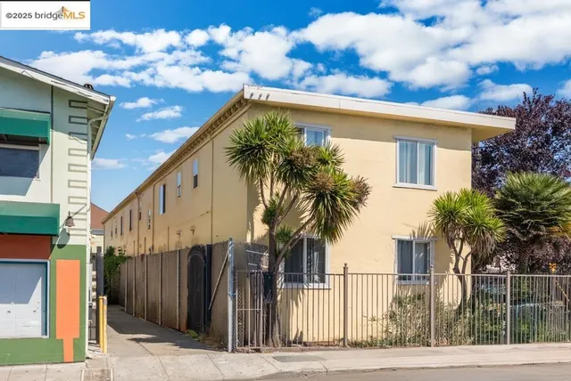 a view of a house with a palm tree
