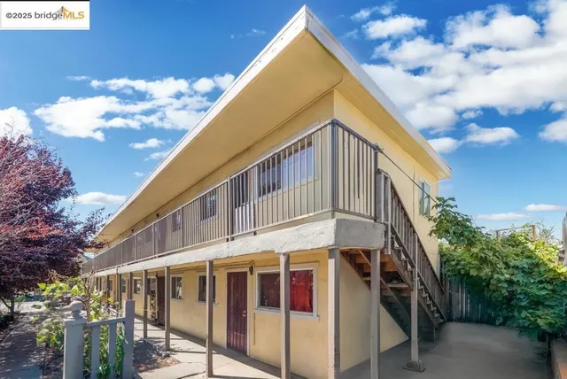 a view of a large building with a small yard