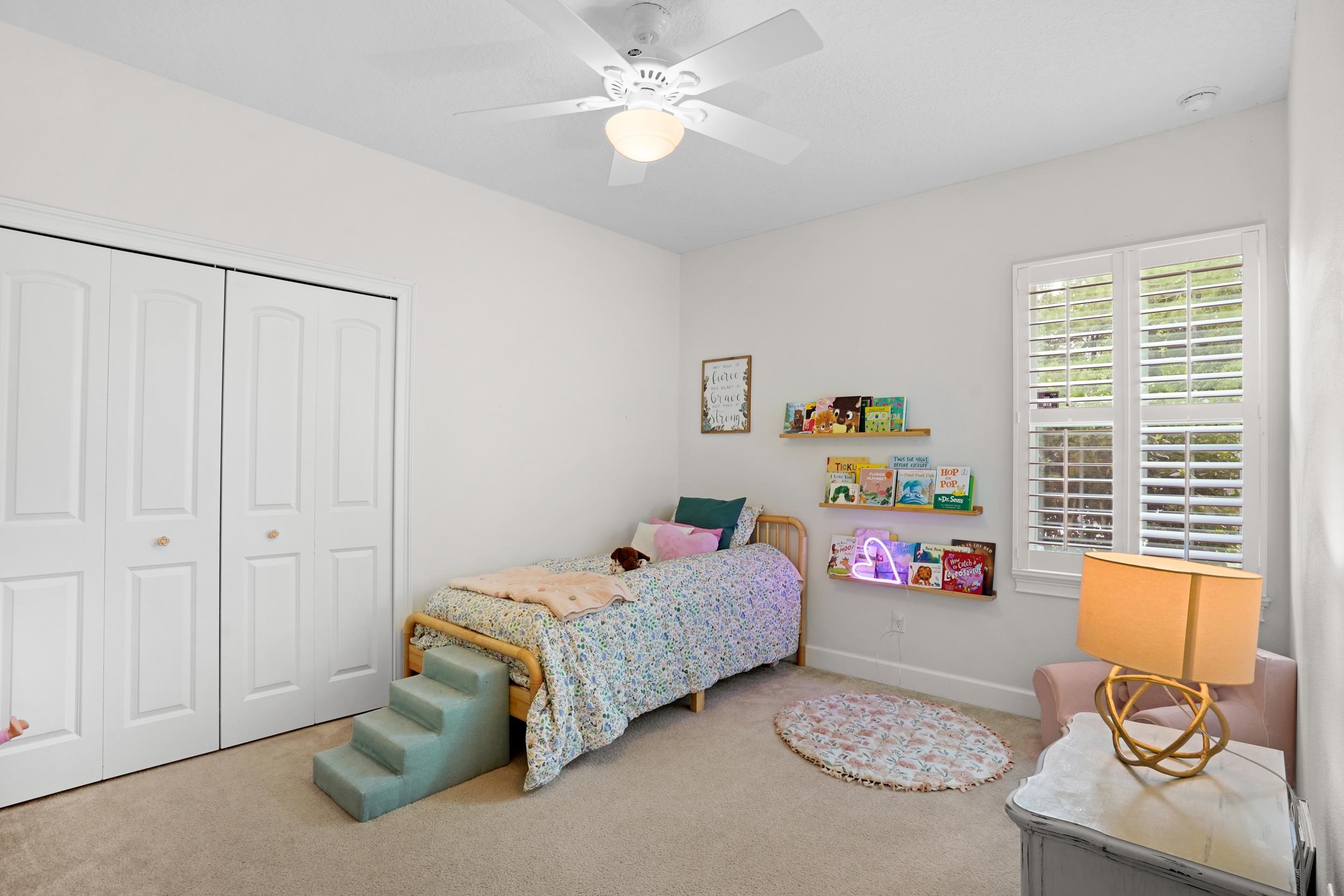 1308 Acorn Ridge Court St. Augustine, FL 32092 - Photo 33 of 47 a bedroom with a bed and a window